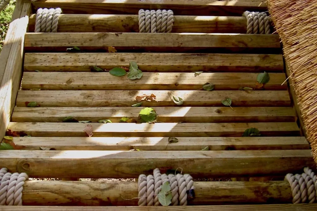 Log-Rope-Bridge-by-Treehouse-Life-Ltd-set-into-treehouse-decks