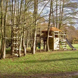 Garden Treehouse in woodland featuring decks, Slide, Climbing Wall, Rope Bridge and big 4-sided Rope Ladder