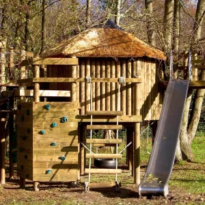 Woodland Treehouse project featuring a Slide, Rope Ladder and Climbing Wall