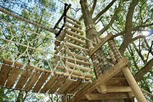 Tree platform leading to a suspended Rope Bridge, 4-sided Rope Ladder and Treetop Walkway