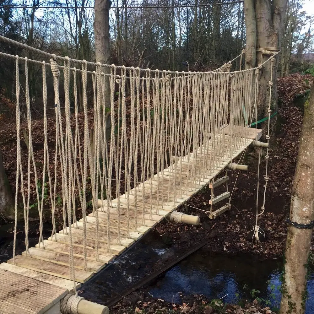 amazing+woodland+rope+bridge Suspended Rope Bridge set across small stream between two trees.