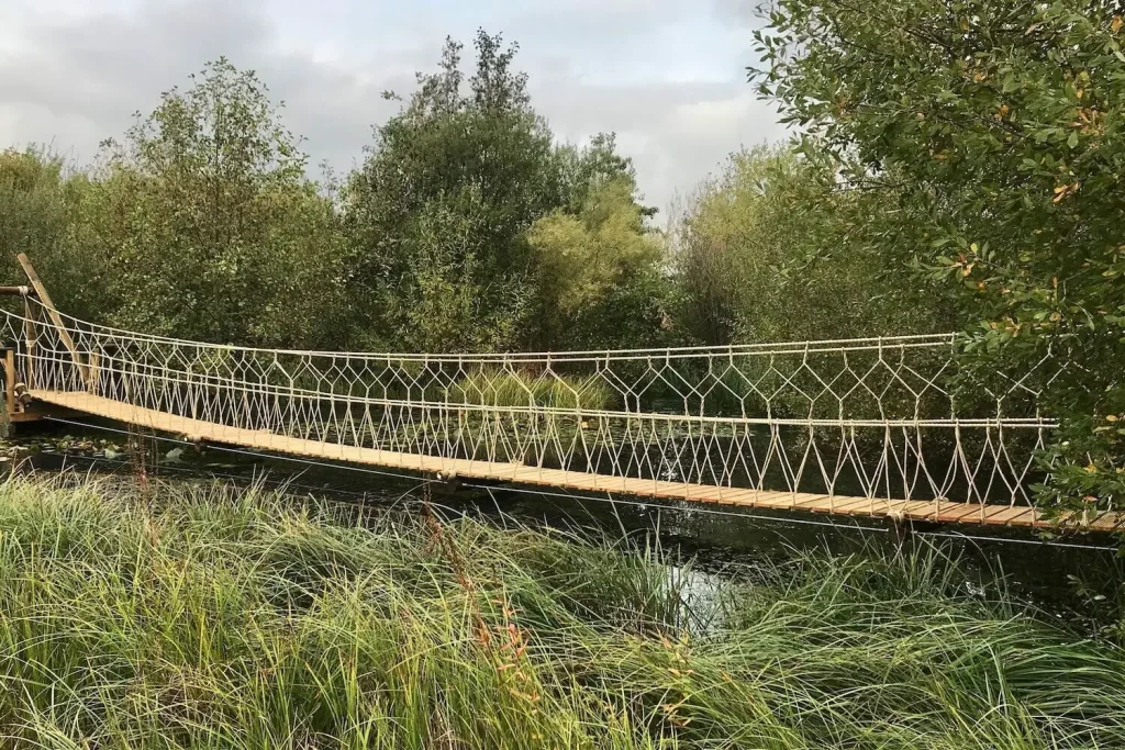 Suspended Rope Bridge across a lake.